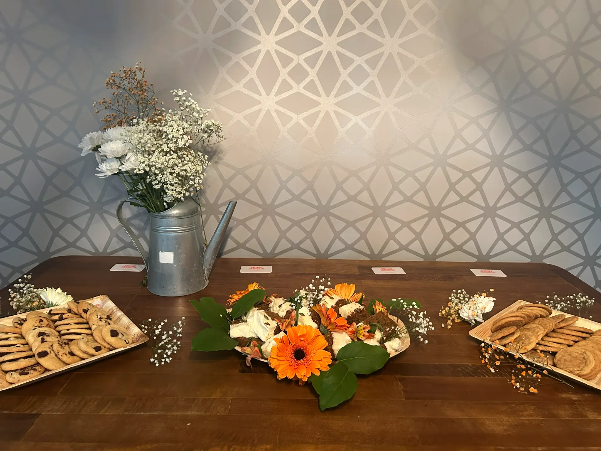 Artisan cookies display with floral arrangements